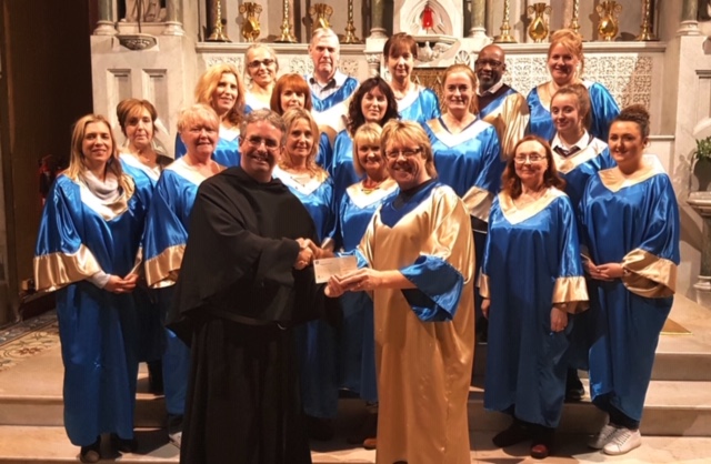 Fr. Colm pictured with a choir